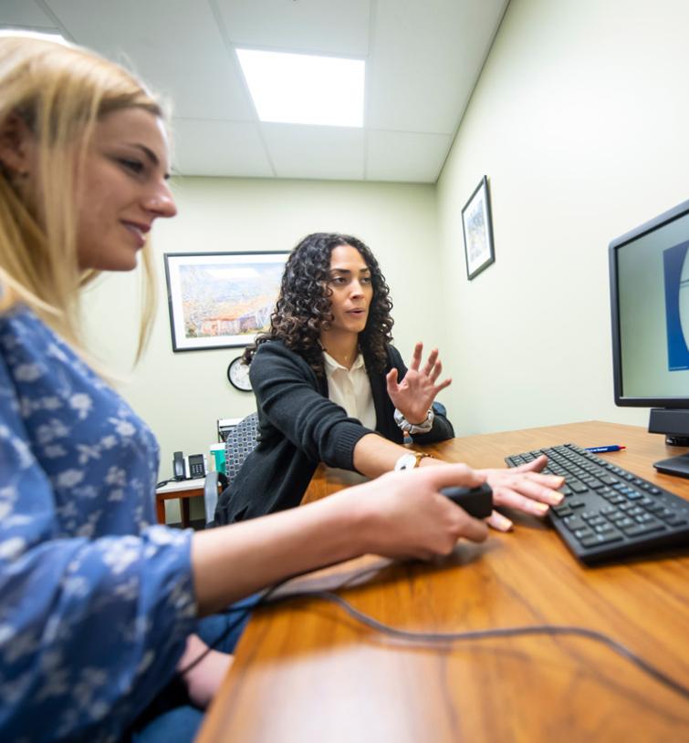 Two women working on a computer